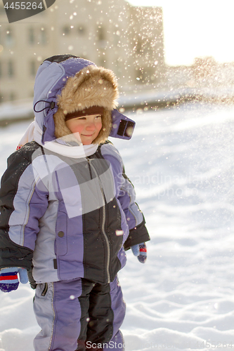 Image of Boy enjoying the first snow