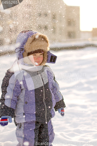 Image of Boy enjoying the first snow