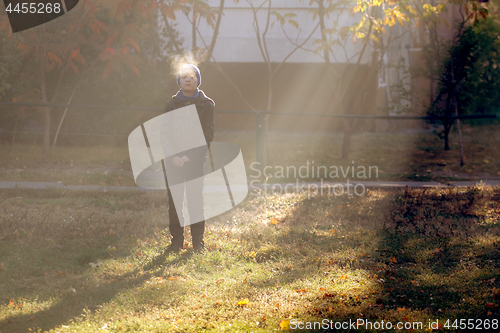 Image of Boy on frosty morning in park