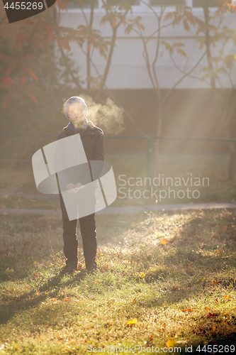 Image of Boy on frosty morning in park