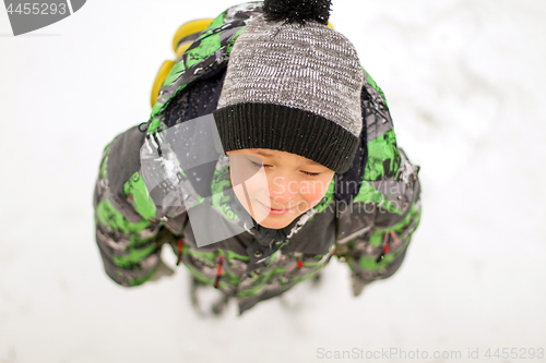 Image of Boy enjoying the first snow