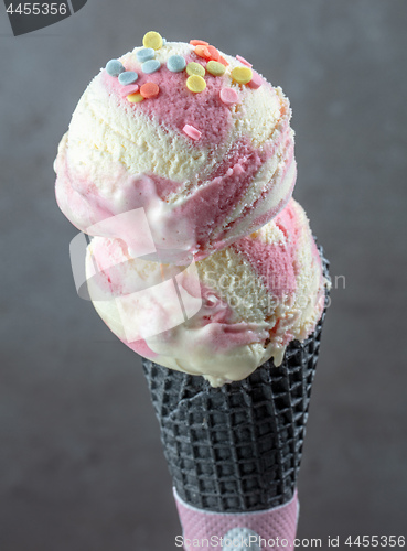 Image of Ice cream balls in black waffle cone