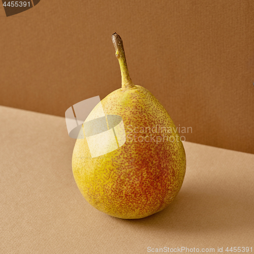 Image of fresh pear on brown background