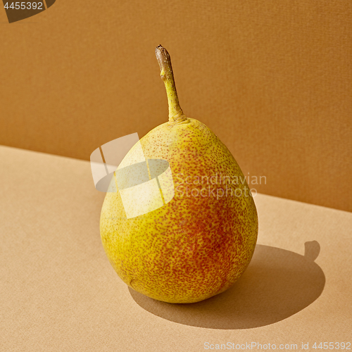 Image of pear with long shadow