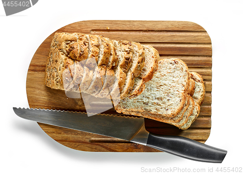 Image of sliced bread on wooden cutting board