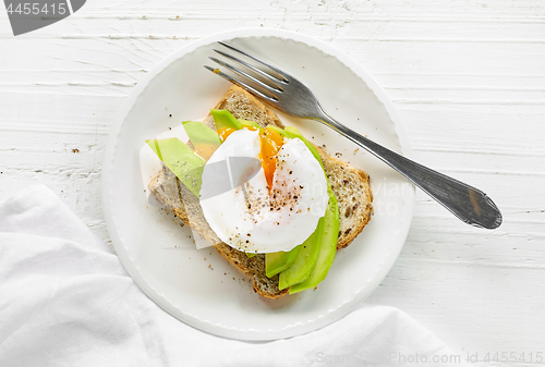 Image of sandwich with avocado and poached egg