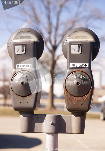 Image of Old Rusted Parking Meters Still in Service Urban Streets