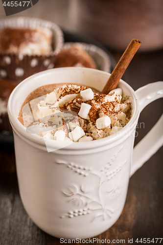 Image of Christmas hot chocolate with whipped cream and cookies