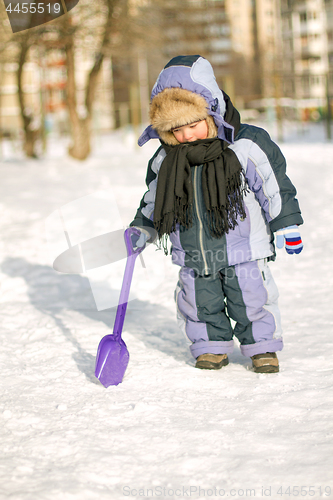 Image of Boy enjoying the first snow