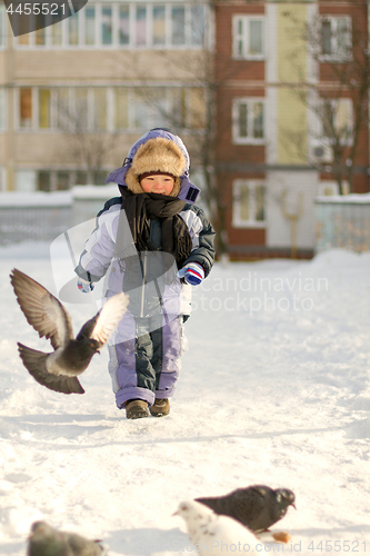 Image of Boy enjoying the first snow