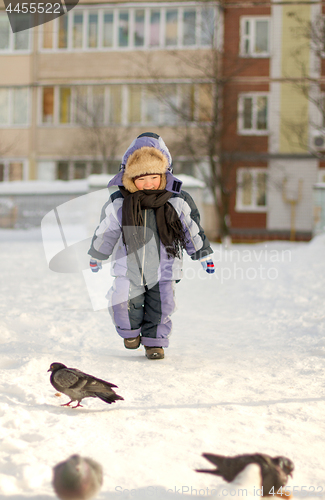 Image of Boy enjoying the first snow