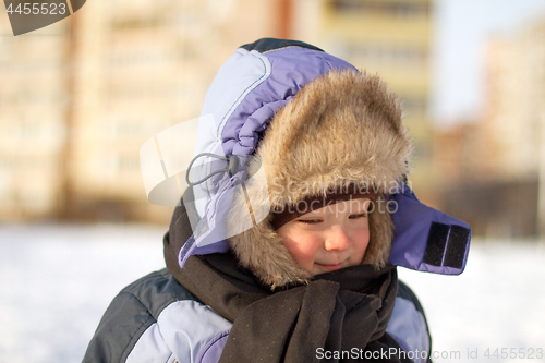 Image of Boy enjoying the first snow