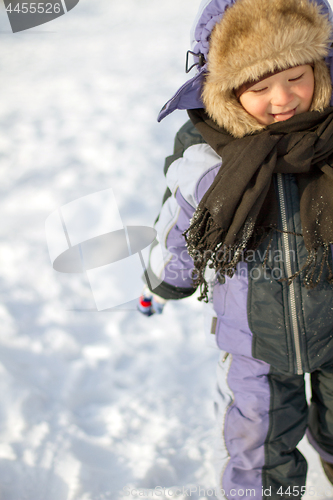 Image of Boy enjoying the first snow