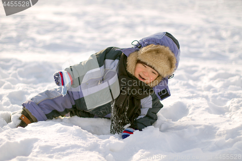 Image of Boy enjoying the first snow