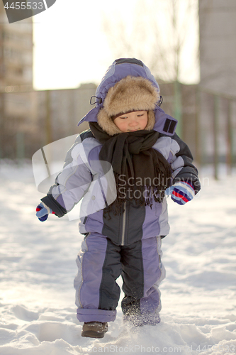 Image of Boy enjoying the first snow