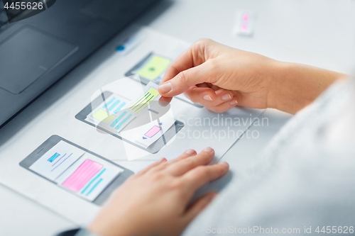 Image of web designer working on user interface wireframe