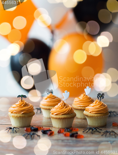 Image of halloween party cupcakes or muffins on table