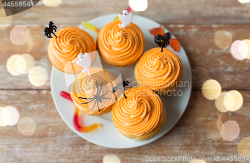 Image of halloween party cupcakes with decorations on plate