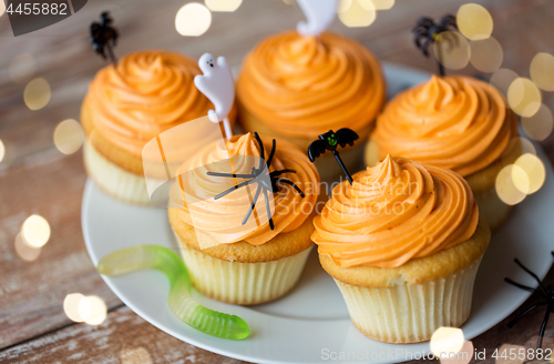 Image of halloween party decorated cupcakes on plate