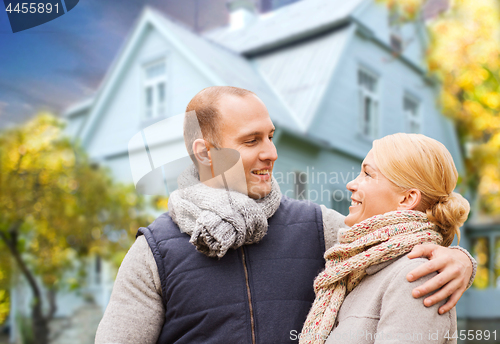 Image of happy couple over living house in autumn