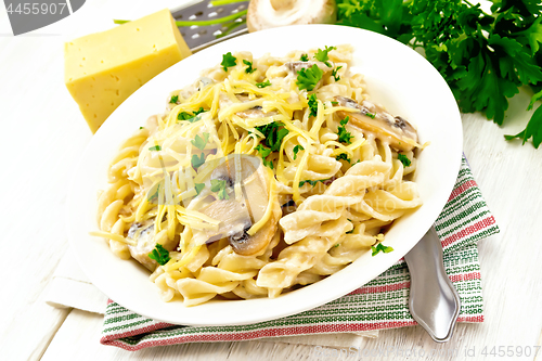 Image of Fusilli with mushrooms on board