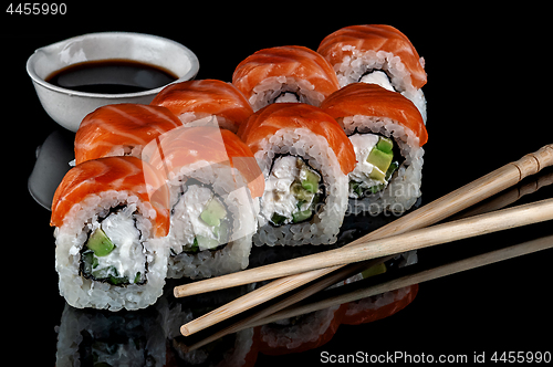 Image of Philadelphia sushi rolls with chopsticks