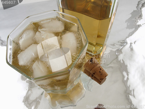 Image of Glass of Alcohol with bottle and cork