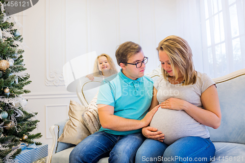 Image of Family portrait near christmas tree