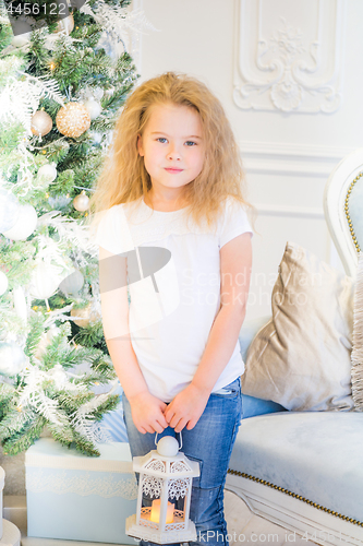 Image of Cute girl and Christmas Tree