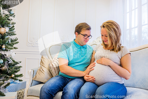 Image of Family portrait near christmas tree