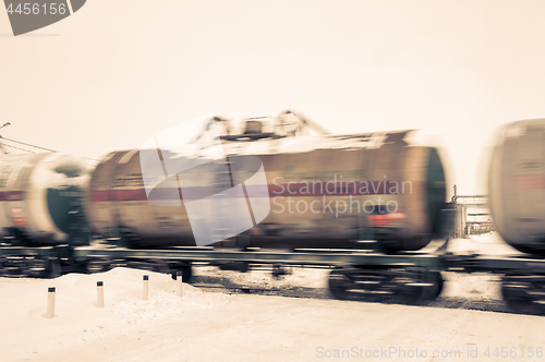 Image of Train with oil tanks moving.