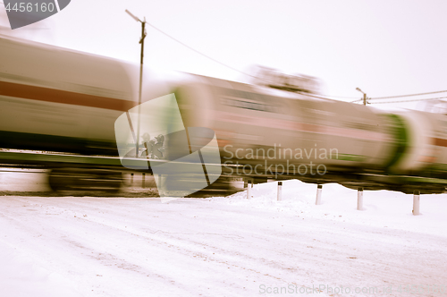 Image of Train with oil tanks moving.