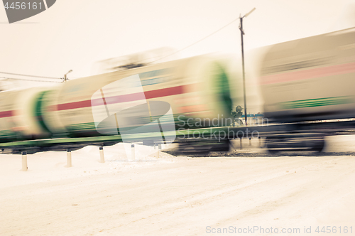 Image of Train with oil tanks moving.