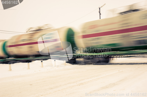 Image of Train with oil tanks moving.