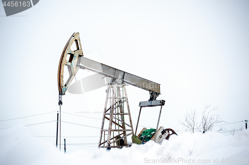 Image of Pump Jack on a oilfield.