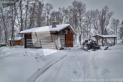 Image of Winter Snowy Landscape with Log Cabin