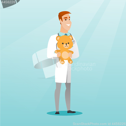 Image of Pediatrician doctor holding teddy bear.