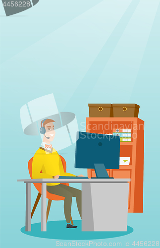 Image of Businessman with headset working at office.