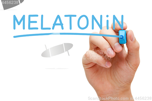 Image of Hand Writing Melatonin With Blue Marker