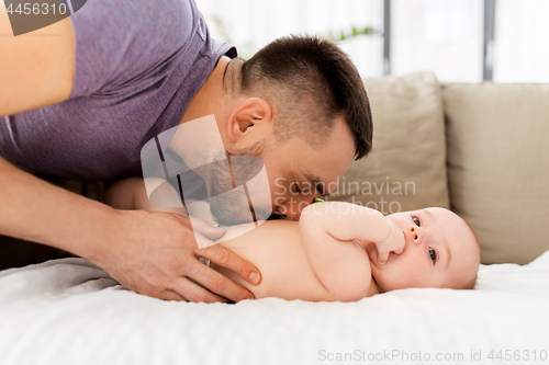 Image of close up of father with little baby at home