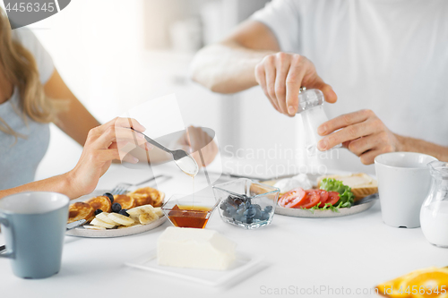 Image of close up of couple having breakfast at home