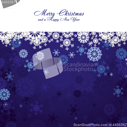 Image of Blue christmas background with snowflakes and wish of Merry Christmas