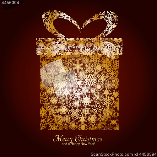 Image of Christmas card with gift box made from gold snowflakes on brown backgroun