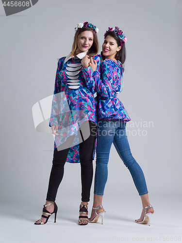 Image of two Fashion Model girls isolated over white background