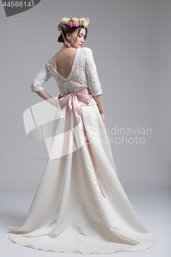 Image of Rear view of a beautiful young woman in a wedding dress