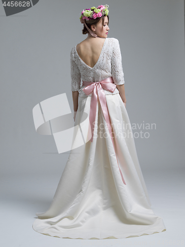 Image of Rear view of a beautiful young woman in a wedding dress