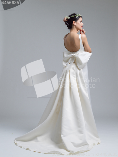 Image of Rear view of a beautiful young woman in a wedding dress