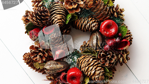 Image of Christmas Wreath on White Wooden Background