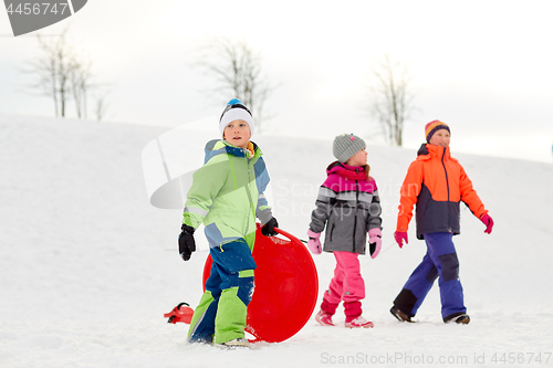 Image of happy little kids with outdoors in winter