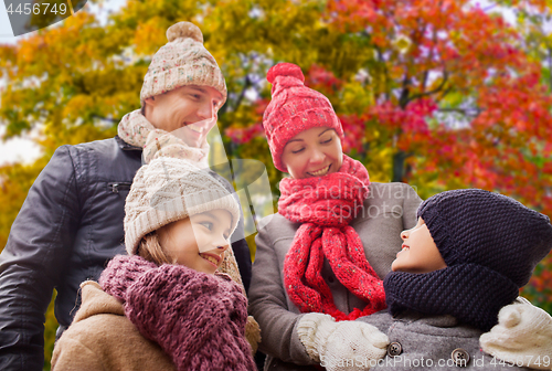 Image of happy family over autumn park background